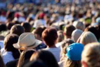 Large crowd of people watching concert or sport event